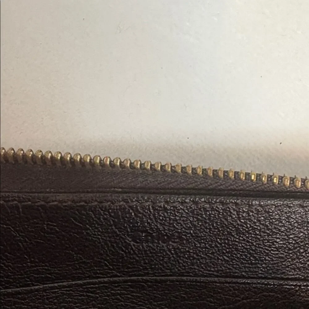 Chloe Lilly bow front long wallet in a metallic maroon brown
